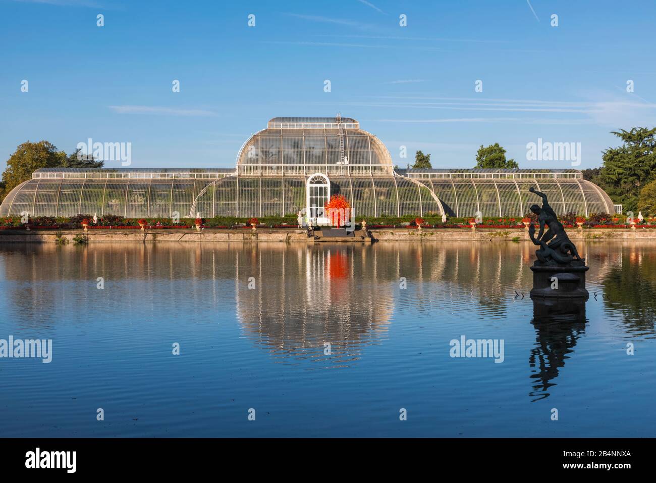 England, London, Richmond, Kew Gardens, The Palm House Reflected in Lake Stock Photo