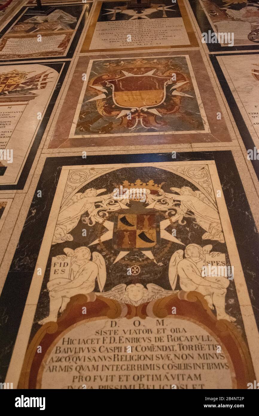 Marble tiles mark the graves of Maltese Knights. St John's CoCathedral is a Roman Catholic co