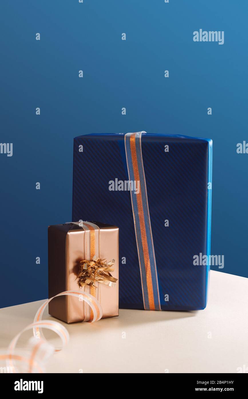 Gold box and blue box gifts on Christmas day. X-mas gifts Stock Photo