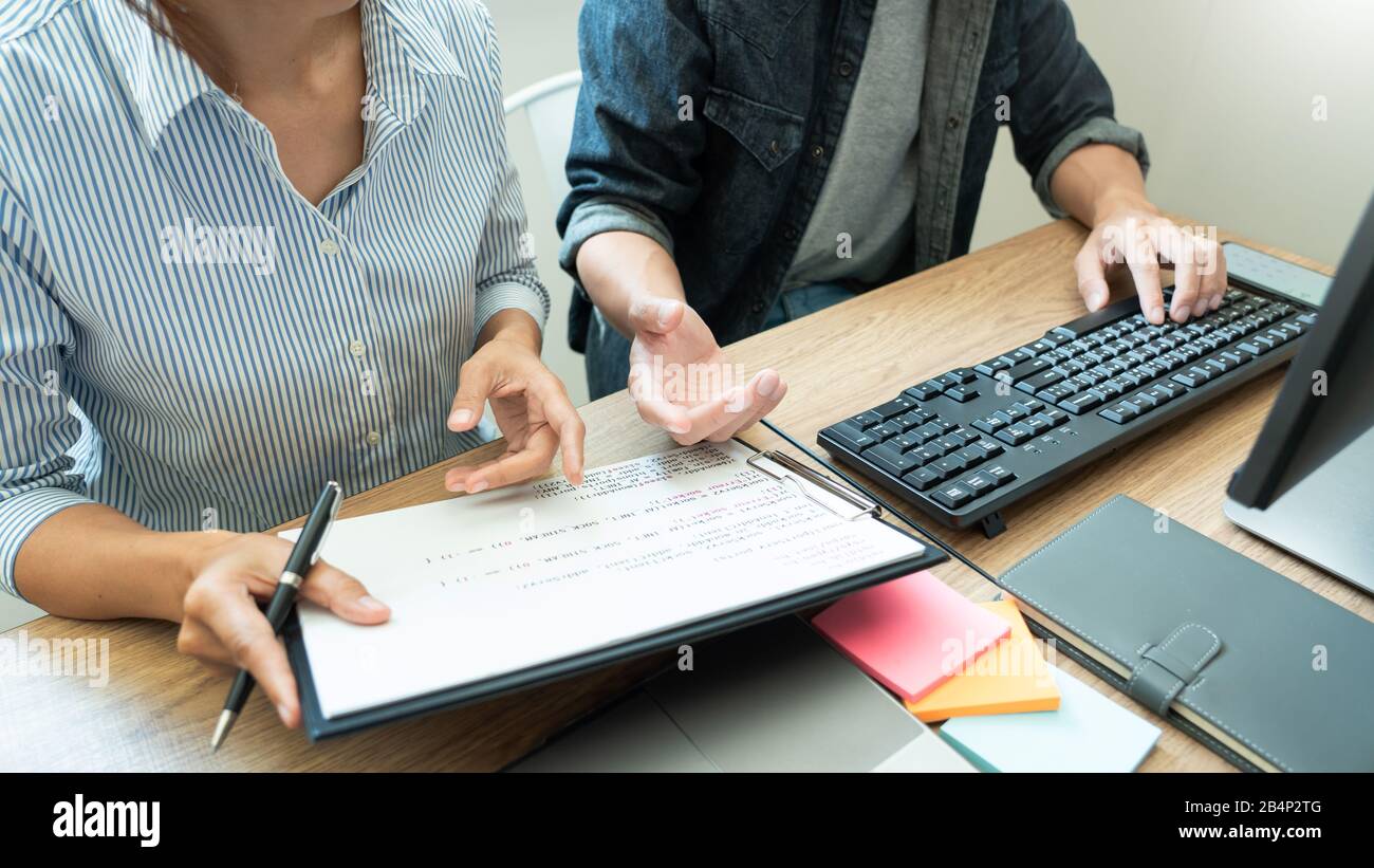 Collaborative work Software engineers website developer technologies or programmer working coding on startup ai application project on screen with par Stock Photo