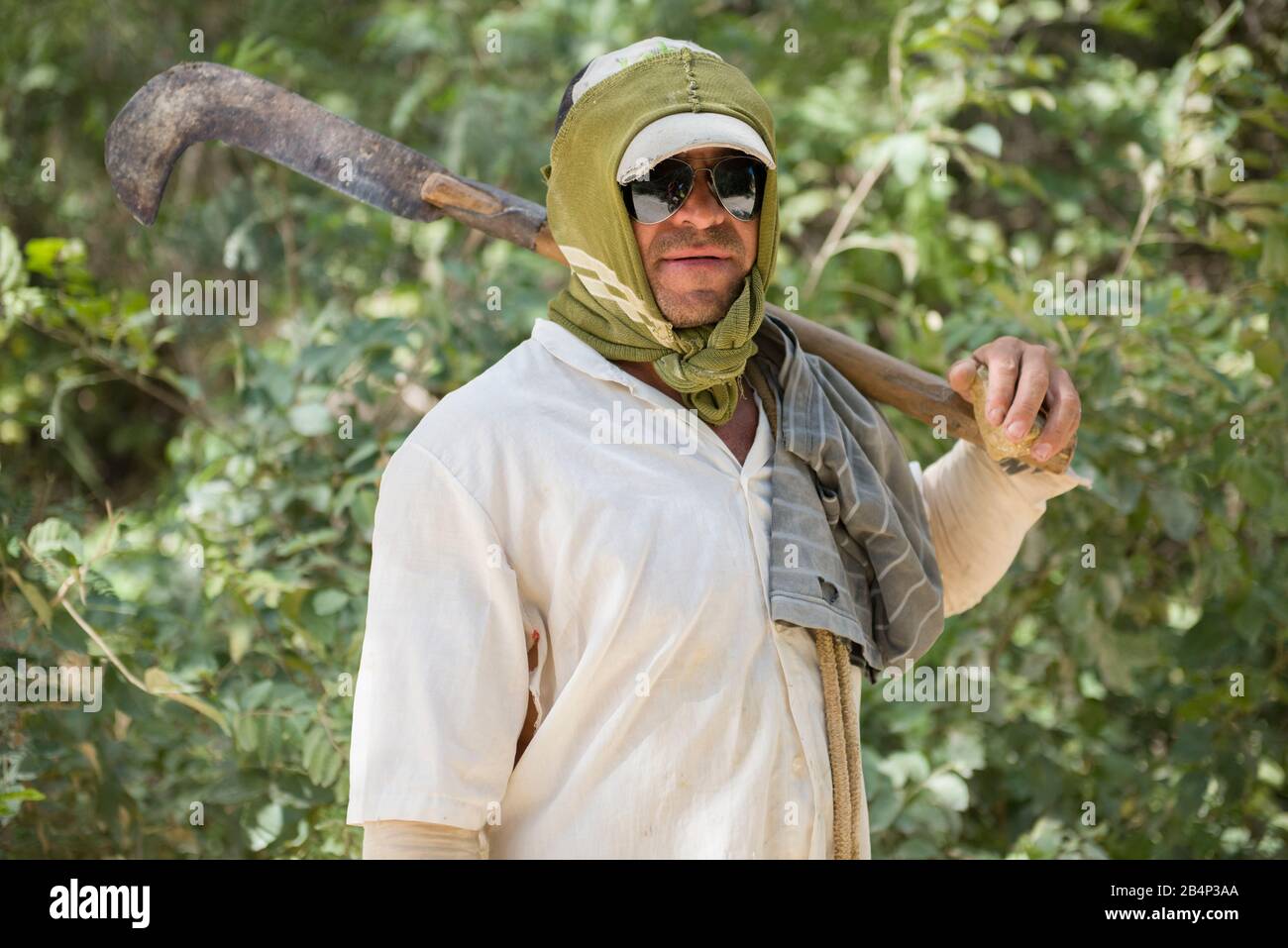 Crato, Ceará, Brazil - June 04, 2016:  Seasonal farm worker in the nature, fully covered with clothes Stock Photo