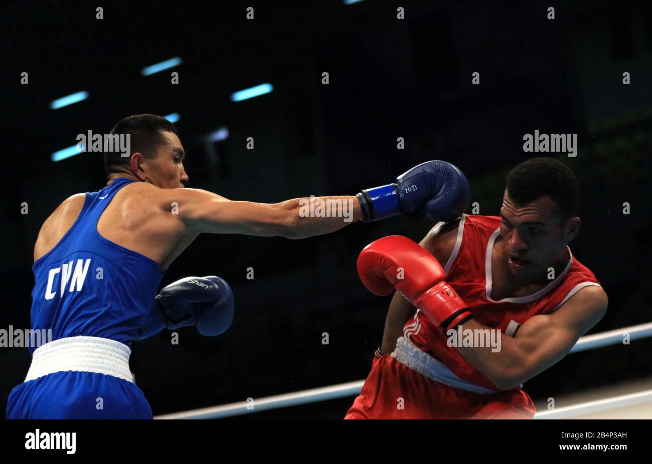 Amman, Jordan. 6th Mar, 2020. Maimaititu Ersun Qiong (L) of China competes  with Zaib Gul of Pakistan during their men's Welterweight (63-69kg)  Preliminaries bout at the Asian/Oceanian Boxing Qualification Tournament  for 2020