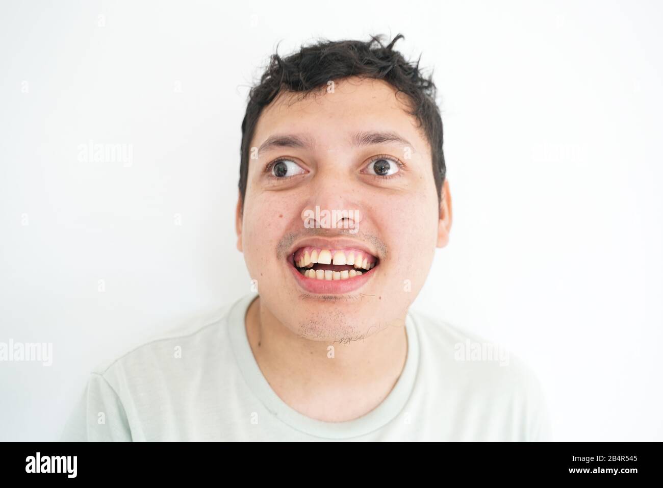Portrait of smiling disable asian men standing on white background half  body Stock Photo - Alamy