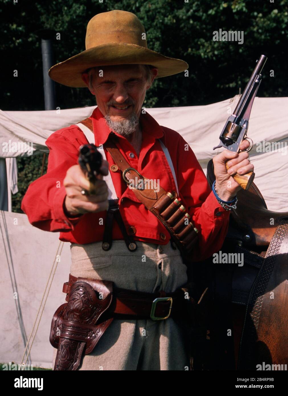 Texican Reenactor holding a Shotgun and Pistols 1889 a member of the Spearfish Creek Re-enactment Society. Stock Photo