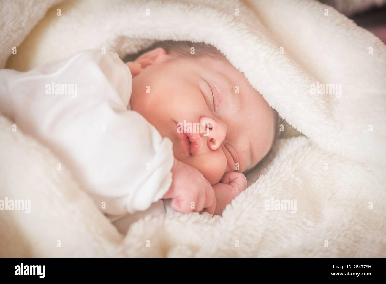 Beautiful Newborn infant baby boy sleeping Stock Photo