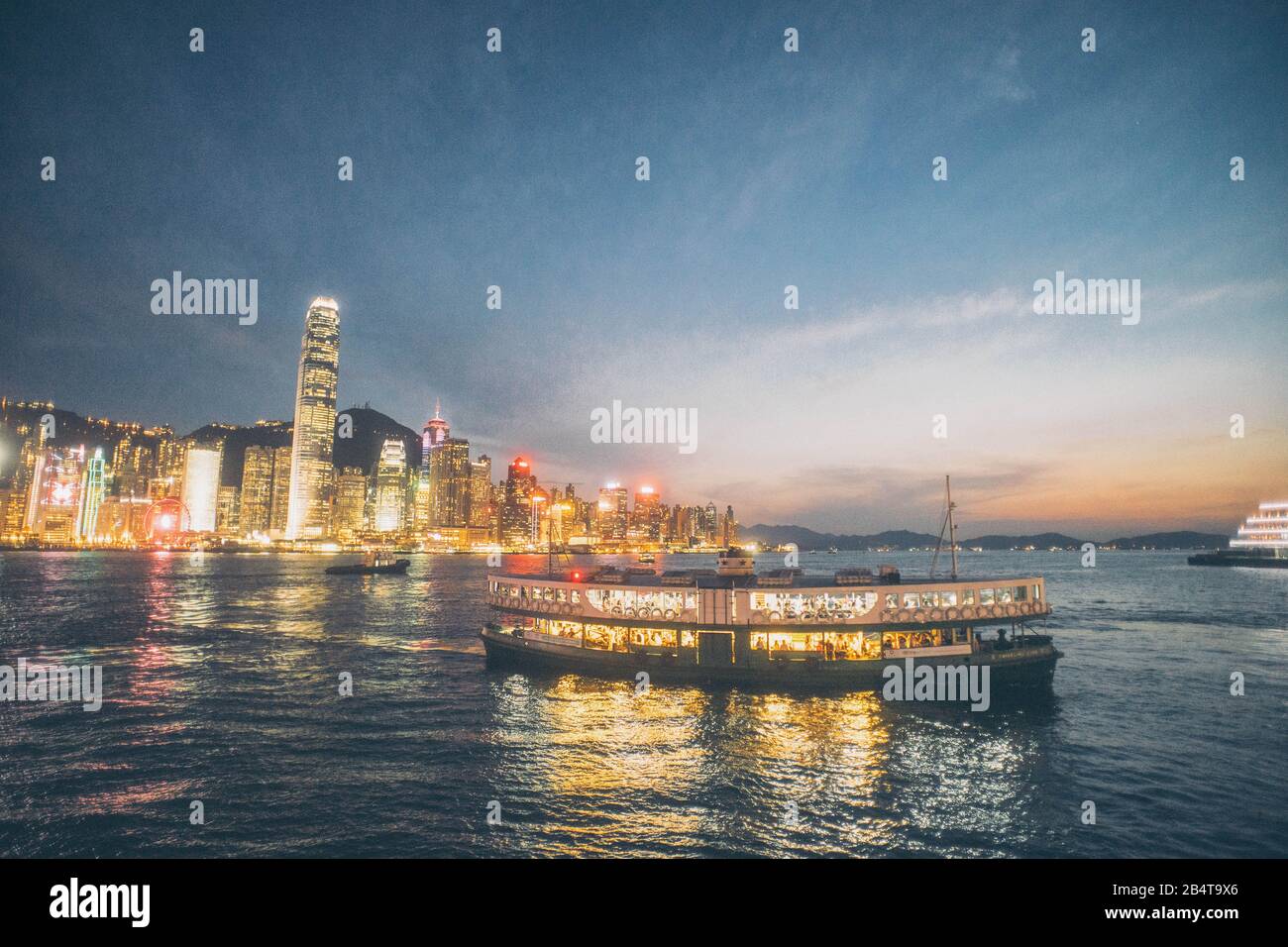 Star ferry cruising in Victoria harbour of Hong Kong. Stock Photo