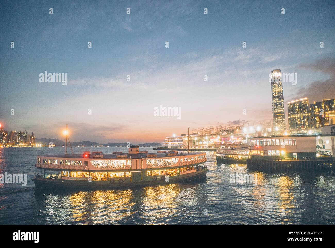 Star ferry cruising in Victoria harbour of Hong Kong. Stock Photo