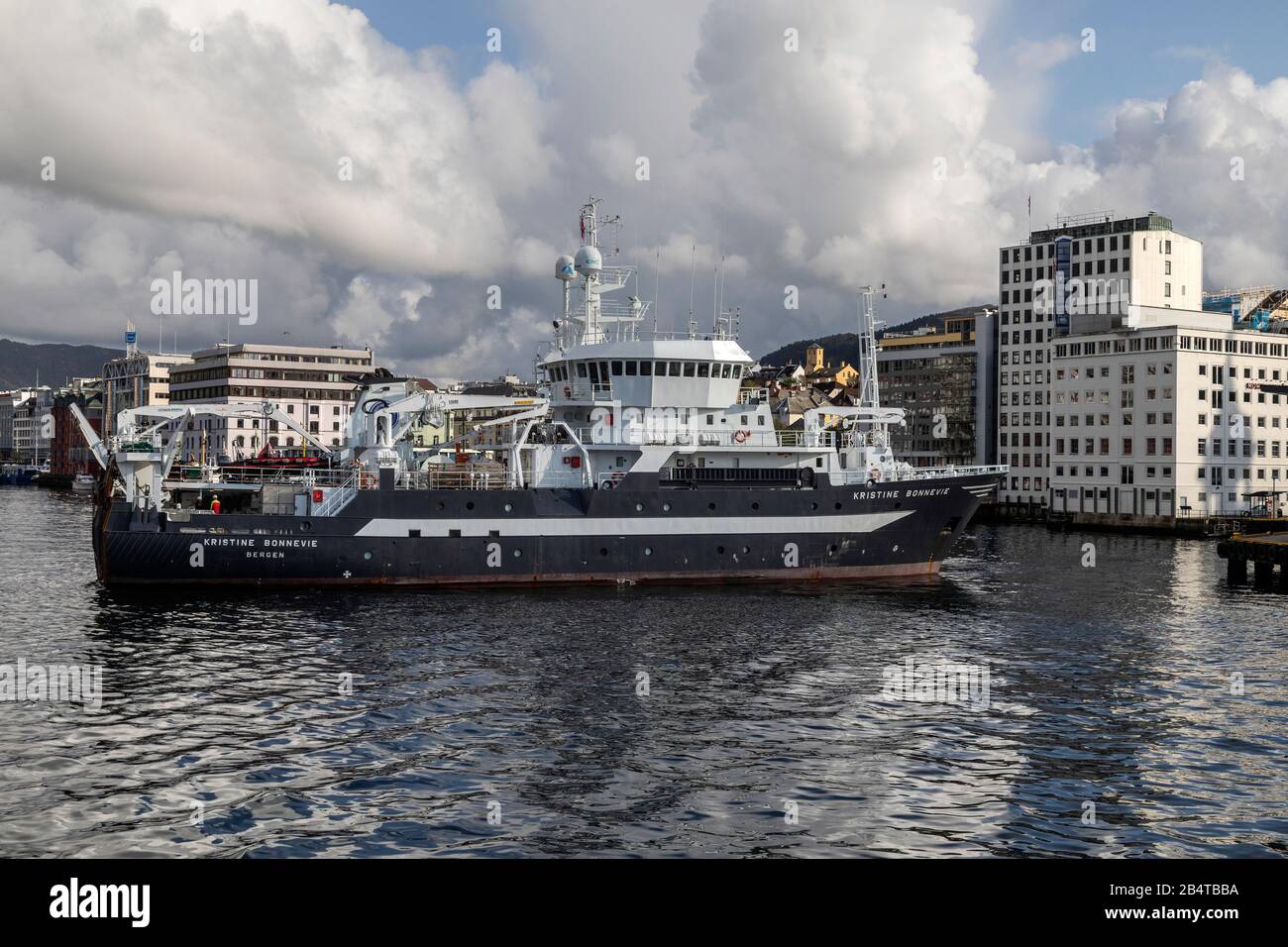 Ocean research vessel Kristine Bonnevie departing from the port of Bergen, Norway. Owned by the University of Bergen, Institute of Marine Research. Stock Photo