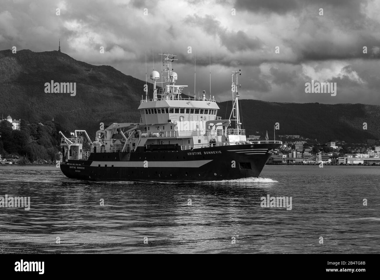 Ocean research vessel Kristine Bonnevie departing from the port of Bergen, Norway. Owned by the University of Bergen, Institute of Marine Research. A Stock Photo