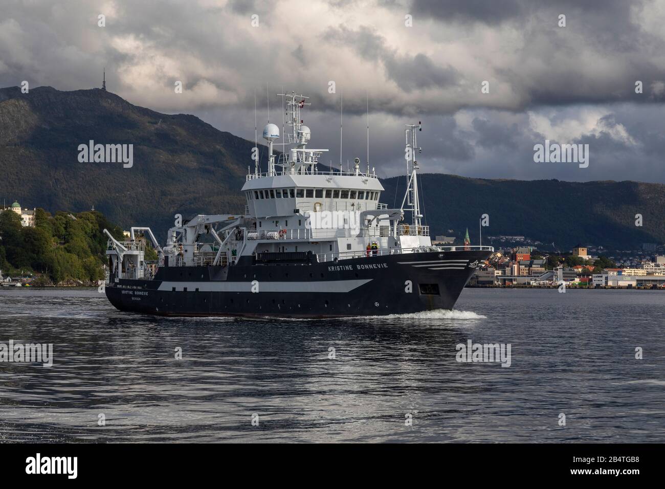 Ocean research vessel Kristine Bonnevie departing from the port of Bergen, Norway. Owned by the University of Bergen, Institute of Marine Research. A Stock Photo