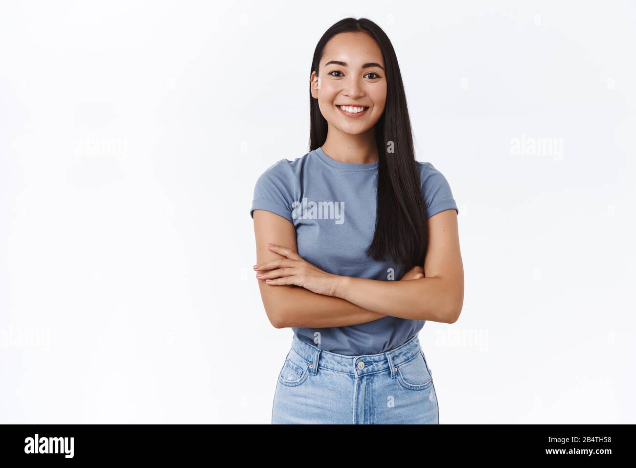 Lively, enthusiastic and determined smiling confident asian girl ready tackle any task, cross fingers over chest assertive, self-assured, smiling Stock Photo