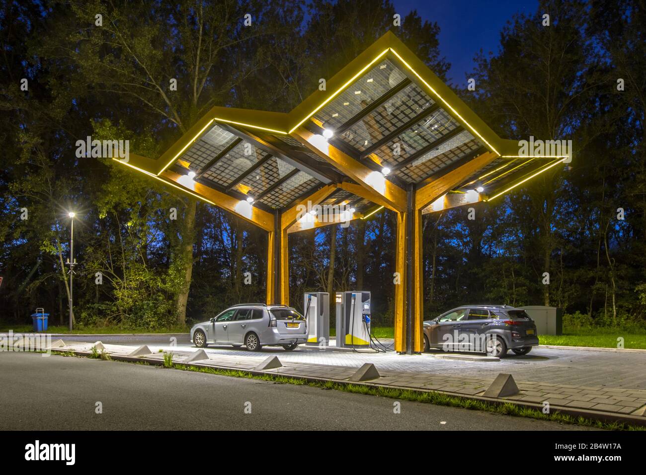 Electric cars charging at electricity filling station in the fast