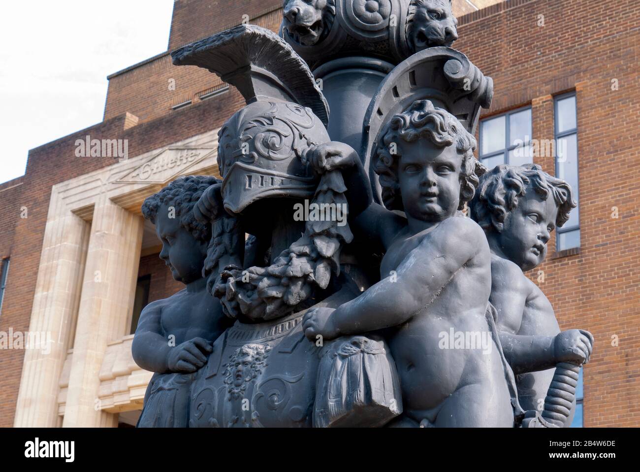 Cherubs on decorative lamp-post at the Gillette Building, Art Deco, Grade II listed structure on Great West Road, Brentford, London, United Kingdom Stock Photo