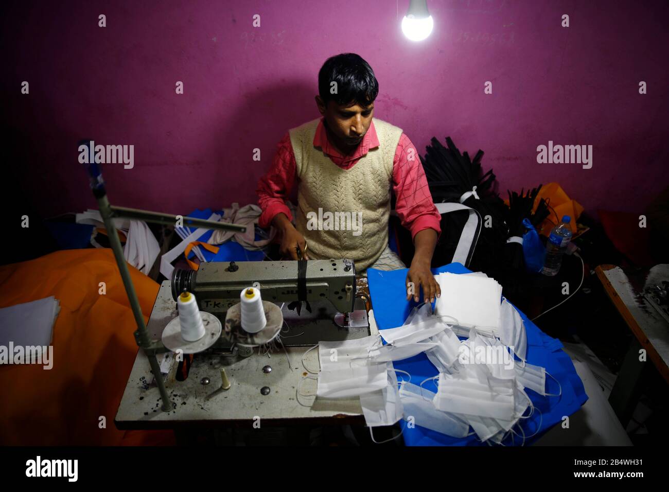 Kathmandu, Nepal. 7th Mar, 2020. A man making fabric face masks due to the shortage in supply caused by coronavirus (COVID-19) outbreak in Kathmandu, Nepal on Saturday, March 07, 2020. According to recent media reports more than 102,581 cases and 3,501 deaths have been reported worldwide. Credit: Skanda Gautam/ZUMA Wire/Alamy Live News Stock Photo