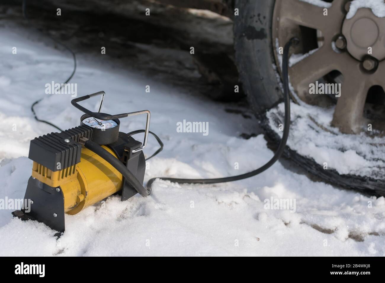 Pump, automobile compressor for inflating tires with air stands in the
