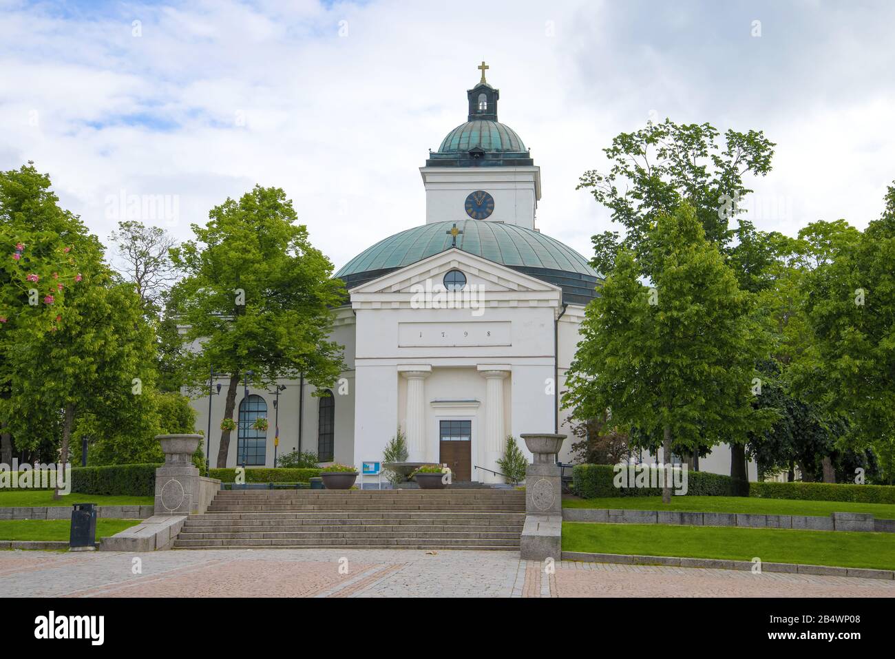 View of the old city church of Hameenlinna on a cloudy June day. Finland Stock Photo