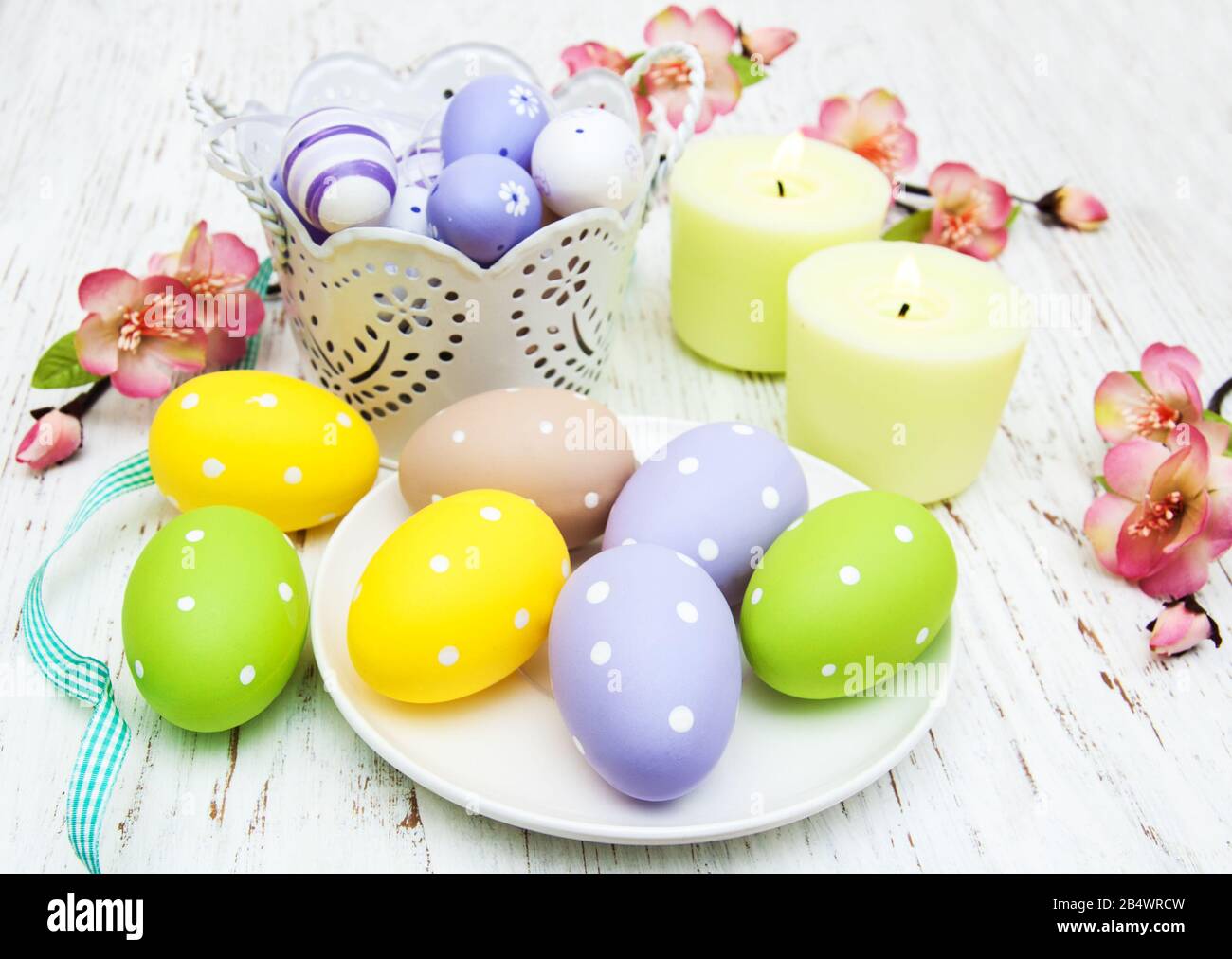 easter table setting, easter eggs, candles and blossom Stock Photo