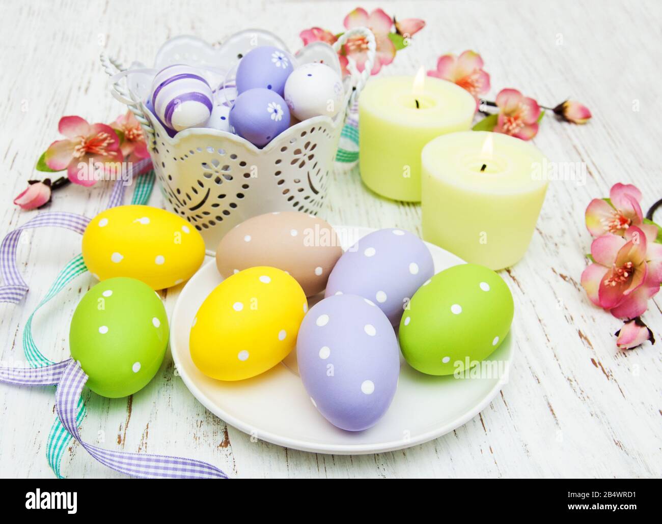 easter table setting, easter eggs, candles and blossom Stock Photo