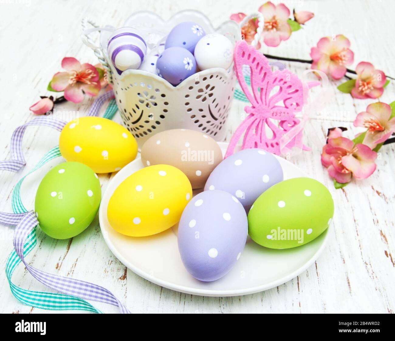 easter table setting, easter eggs, candles and blossom Stock Photo