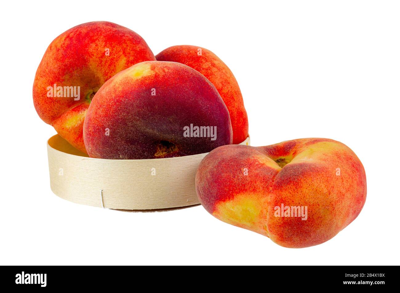Flat peaches in a package on a white background. Stock Photo