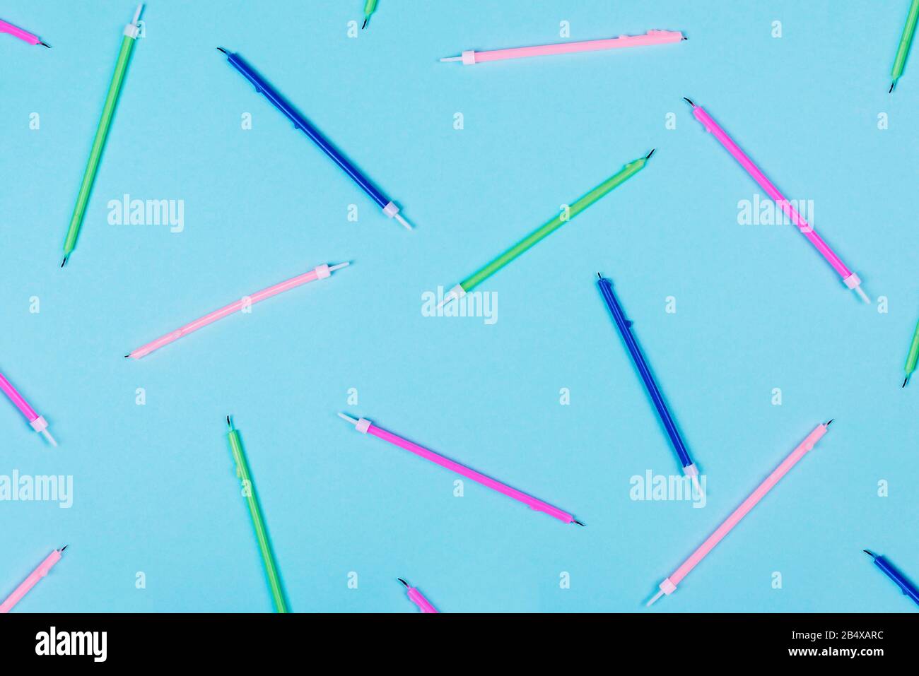 Pattern with colorful birthday candles on pastel blue background with ...