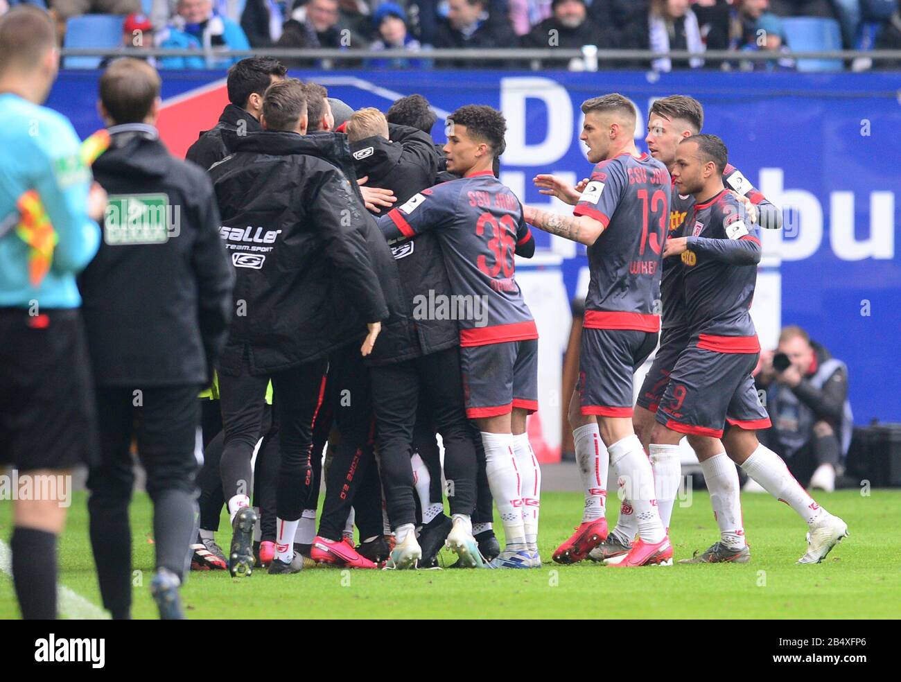 Hamburg, Germany. 07th Mar, 2020. Football: 2nd Bundesliga, 25th matchday: Hamburger SV - Jahn Regensburg in the Volksparkstadion. Regensburg's players cheer after the goal for 1:1. Credit: Daniel Bockwoldt/dpa - IMPORTANT NOTE: In accordance with the regulations of the DFL Deutsche Fußball Liga and the DFB Deutscher Fußball-Bund, it is prohibited to exploit or have exploited in the stadium and/or from the game taken photographs in the form of sequence images and/or video-like photo series./dpa/Alamy Live News Stock Photo
