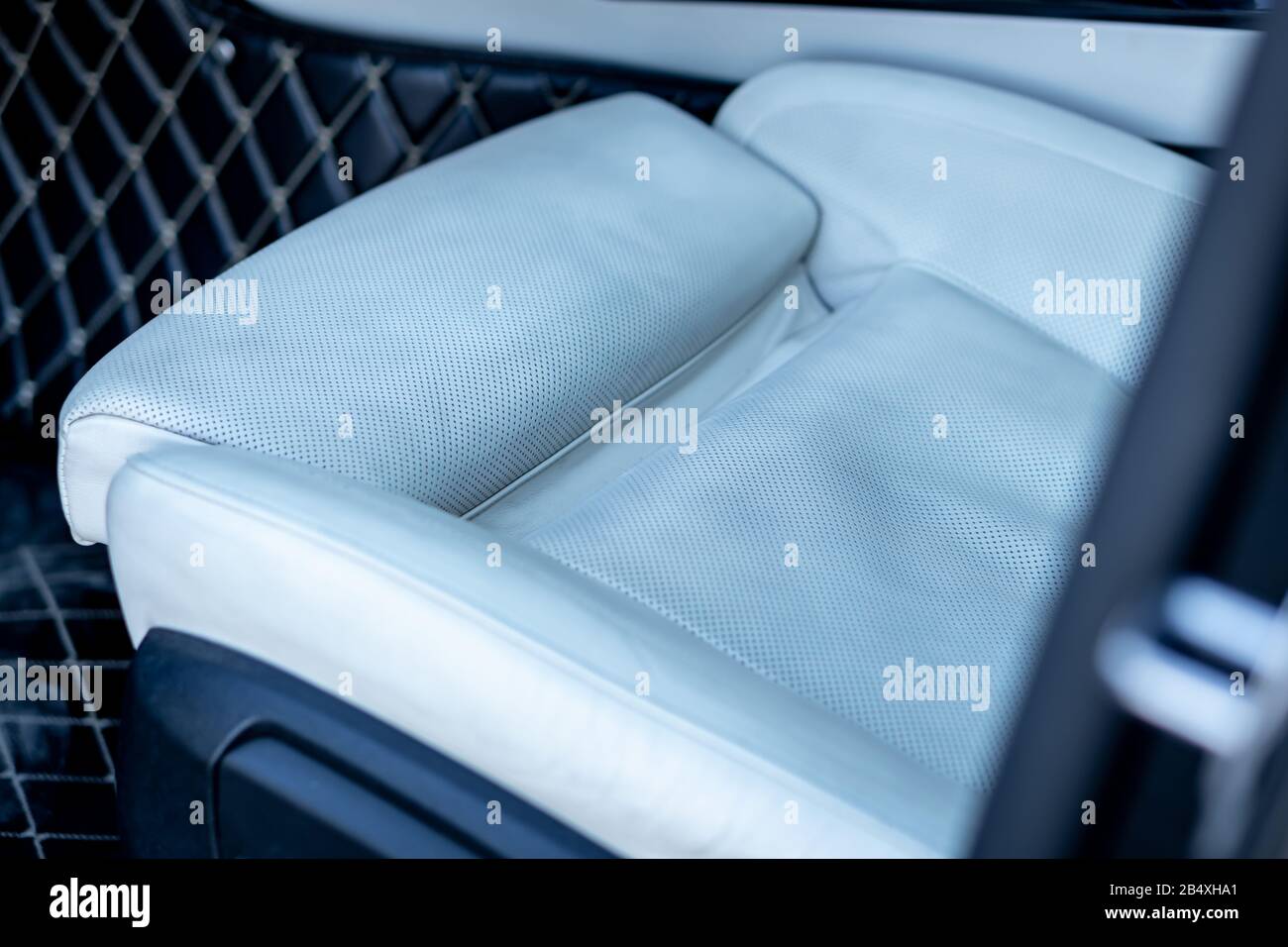Beautiful german car luxurious interior with white leather, black trim ornaments, heated and ventilated seats, harman kardon sound system, individual Stock Photo