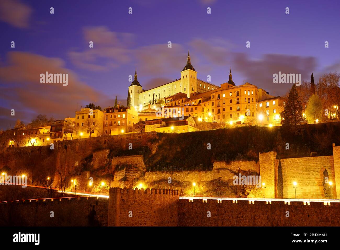 Toledo in Spain at night. Famous UNESCO World Heritage Site. The historic city in beautiful illumination after sunset. Stock Photo