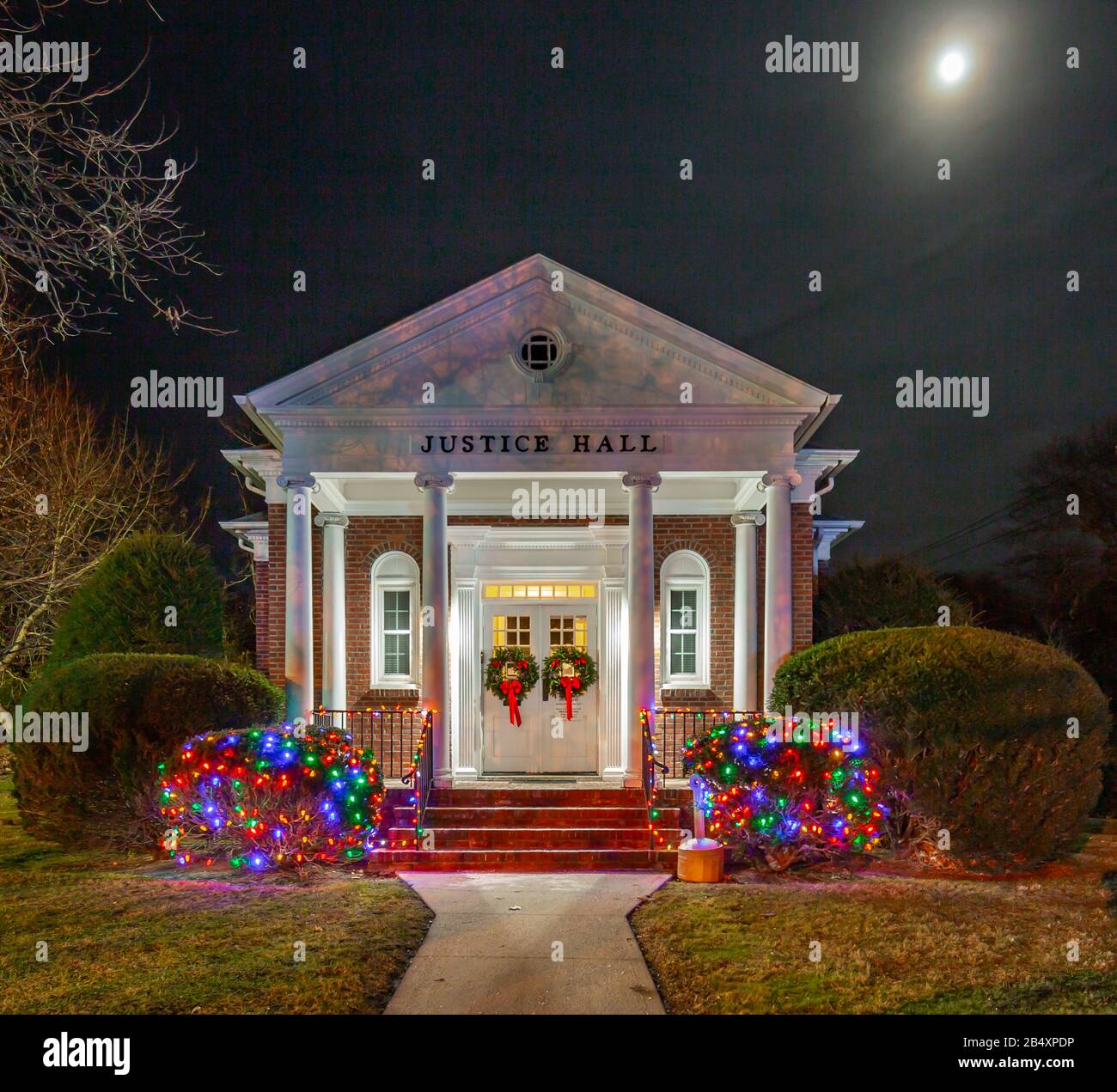 Justice Hall decorated for Christmas at night, Shelter Island, NY Stock Photo