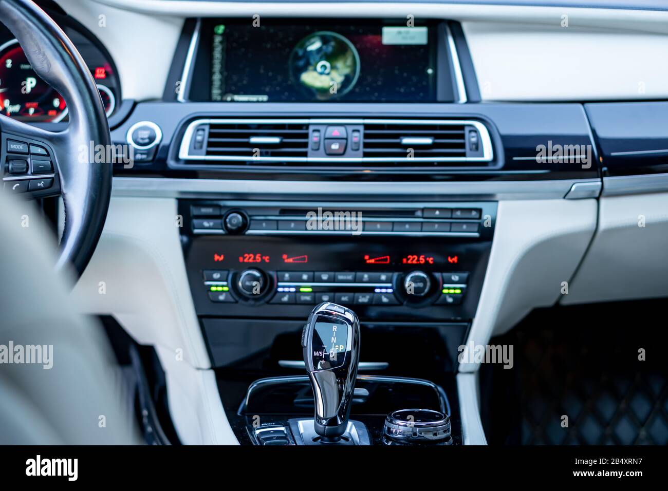 Bmw 750d climate unit and automatic gear knob, close up photo, heated seats button, ventilated seats switch, digital temperature illustration Stock Photo