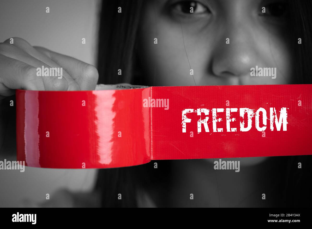 Young woman was wrapping her mount by adhesive tape, Concept freedom of