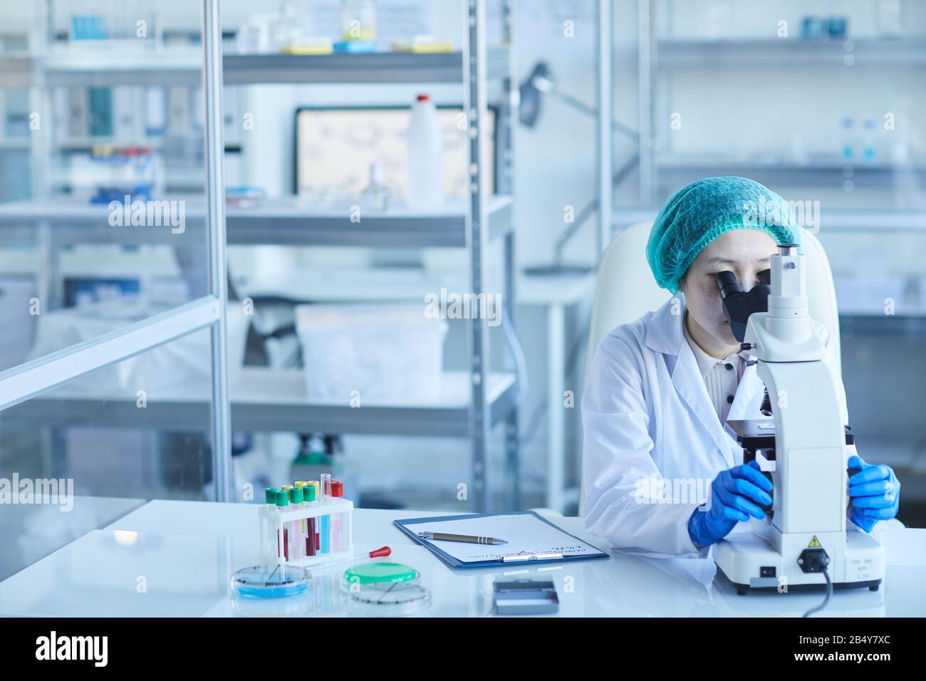 Scientist working pipette microscope hi-res stock photography and ...