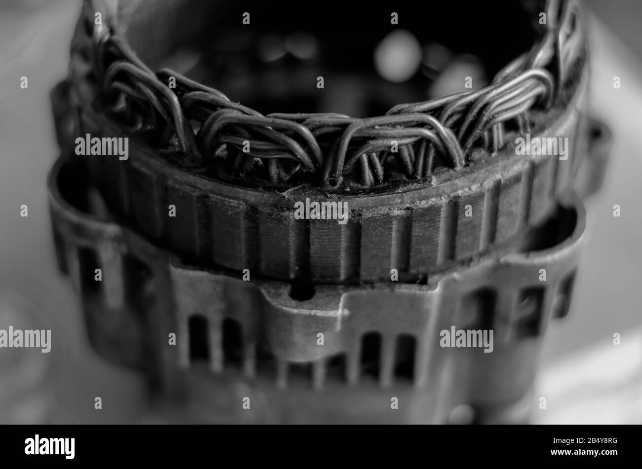 Old stator of a car generator closeup. Repair of a used truck
