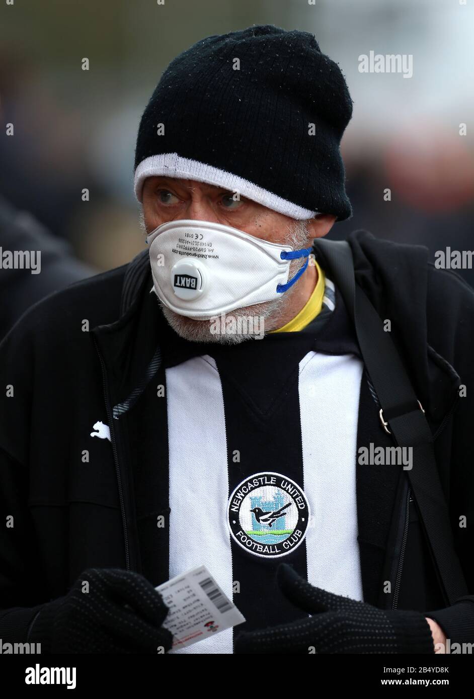 A Newcastle United Fan With A Face Mask In Preparation In The Control Of The Coronavirus Outside The Ground Before The Premier League Match At St Mary S Stadium Southampton Stock Photo