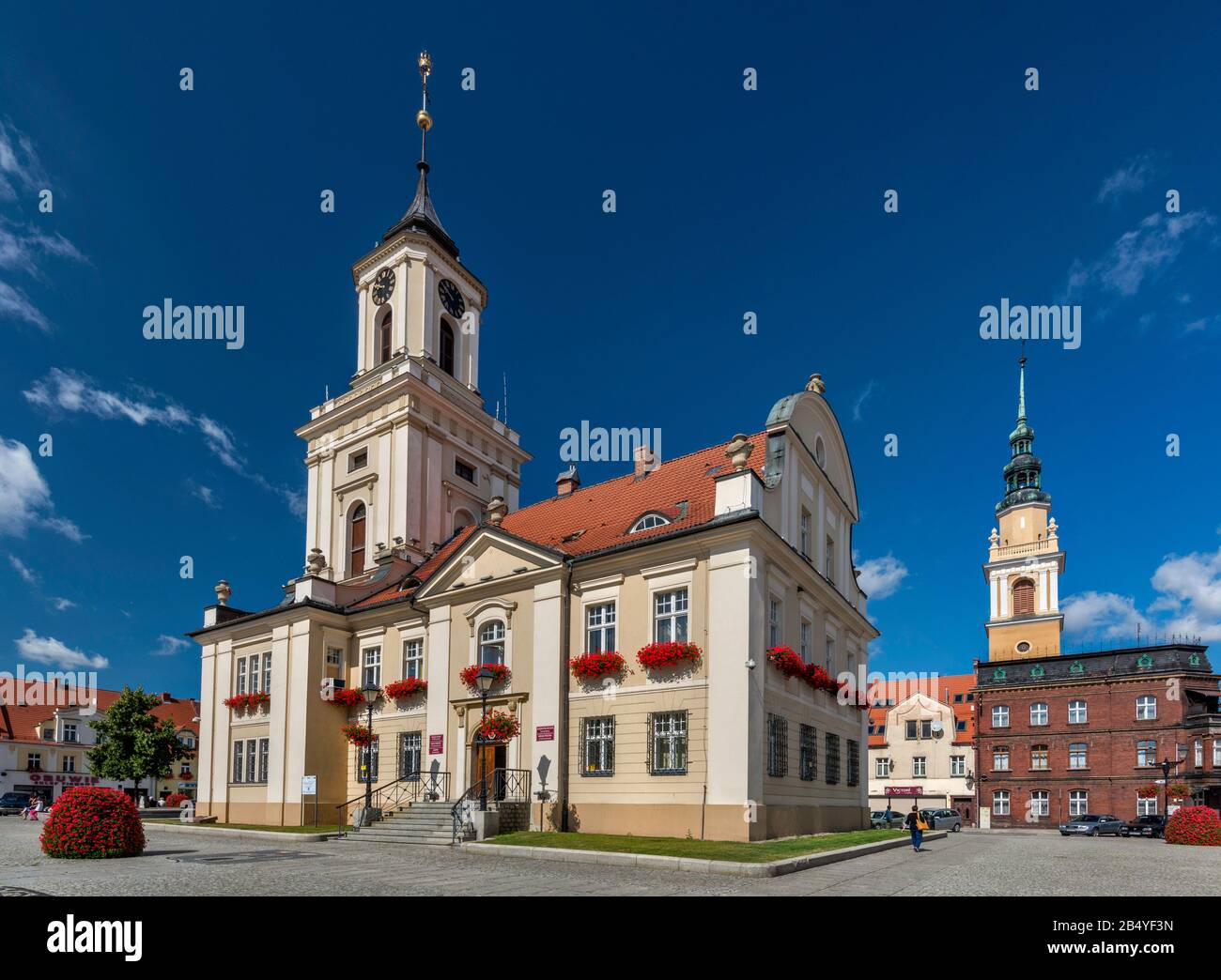 Ratusz (Town Hall), 1781, Classicistic style, Church of SS Peter and Paul behind, in Swiebodzice, Lower Silesia, Poland Stock Photo