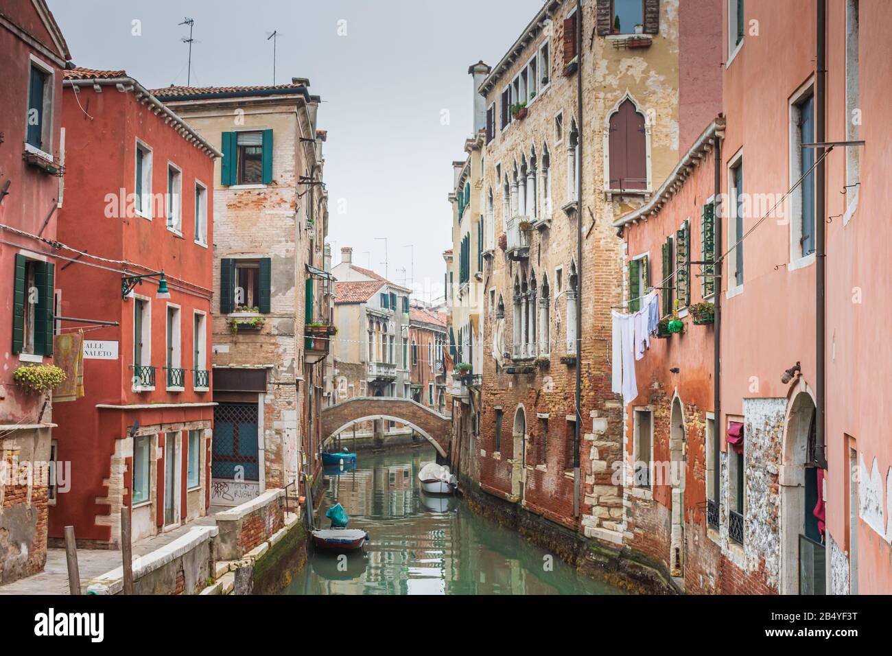 A canal lined with houses and apartments in the residential district of Venice, Italy Stock Photo