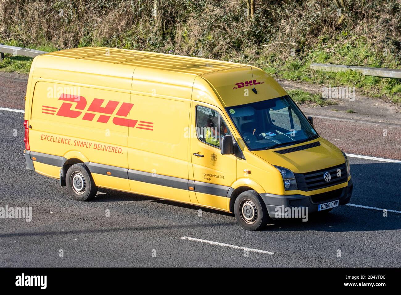 DHL international shipping; Yellow Haulage delivery vans, lorry,  transportation, cargo carrier, vehicle, commercial transport, industry, M61  at Manchester, UK Stock Photo - Alamy