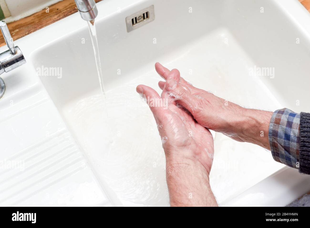 Person washing hands with water and soap in a sink Stock Photo - Alamy