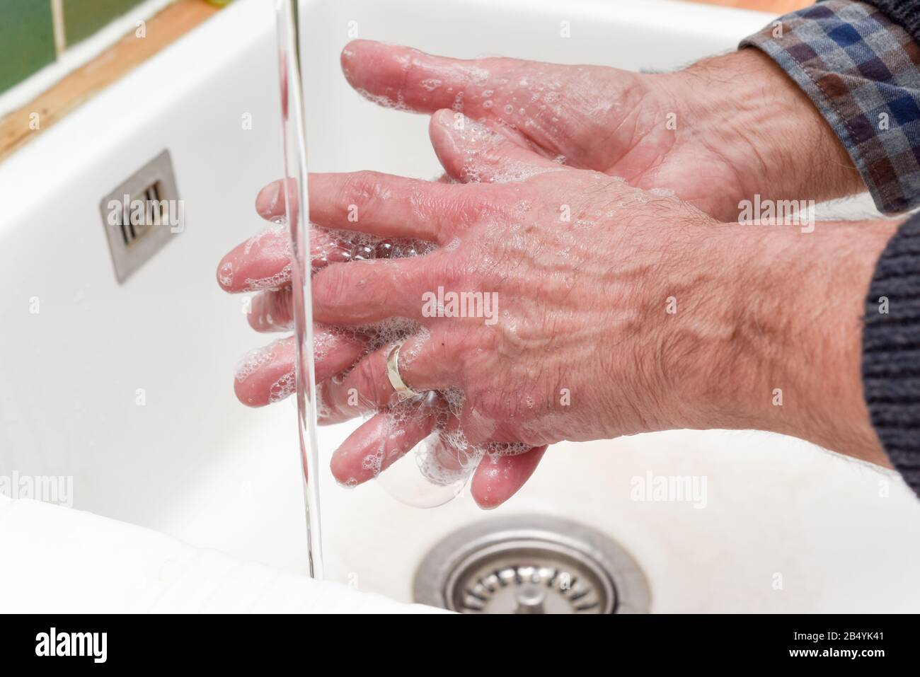 Person washing hands with water and soap in a sink Stock Photo - Alamy