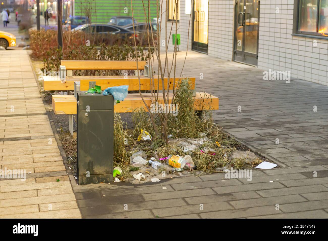 Moscow. Russia. December 2019. Garbage crisis. Overflowing street trash bins. Poor cleaning of the largest management company 'Peak-Comfort'. Stock Photo
