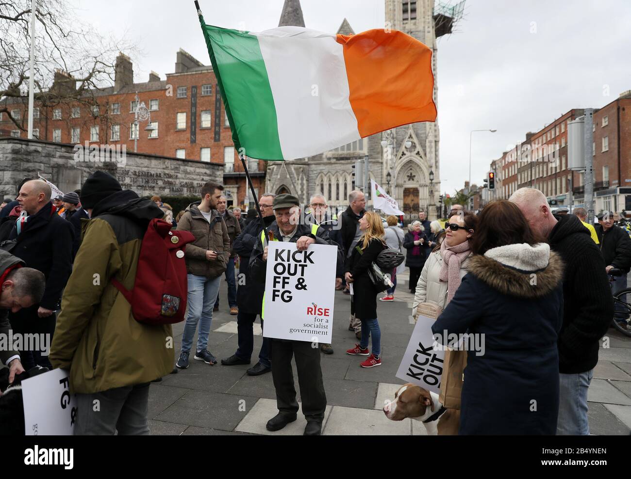 Paddy Morrissey, from Charleville, Cork, arrives to participate in a march in Dublin's city centre organized to demonstrate opposition to the formation of a new government involving Fianna Fail or Fine Gael. Stock Photo
