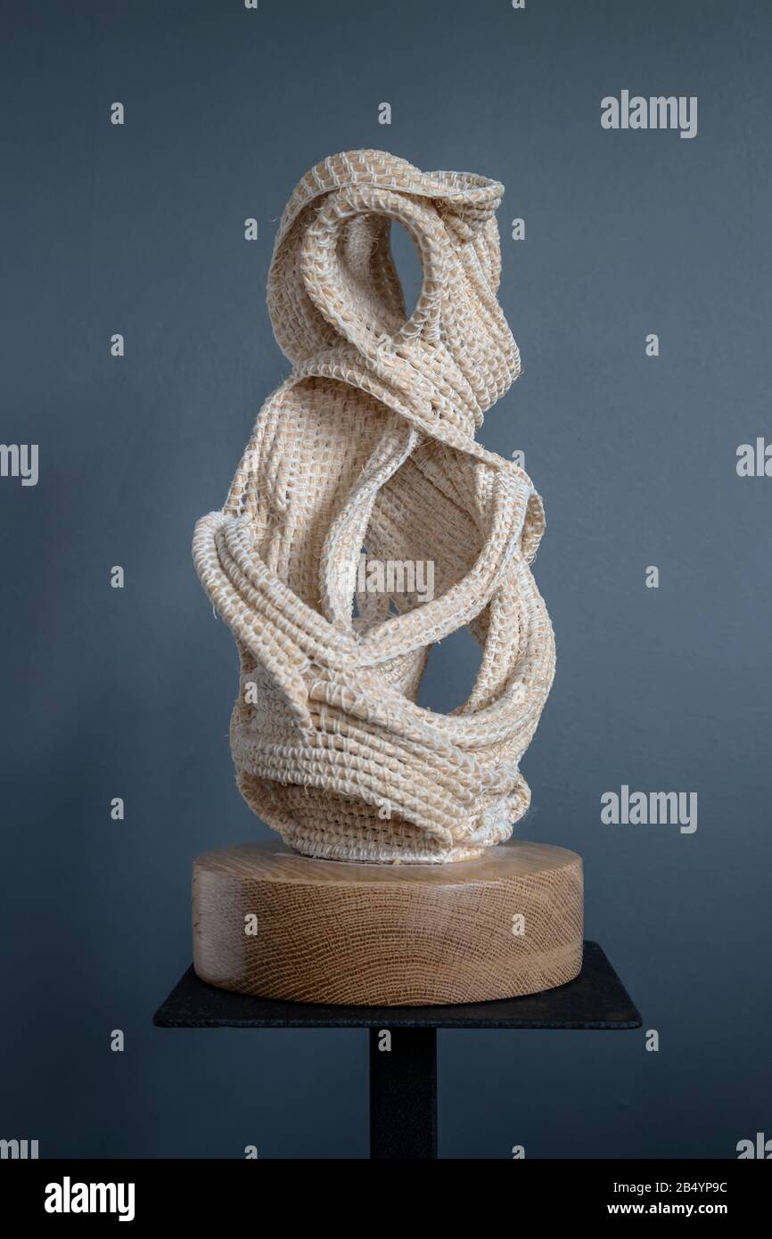 Textile sculpture employing crochet technique comprising sisal string and spun crochet cotton on an oak base by artist Judy Tadman Stock Photo