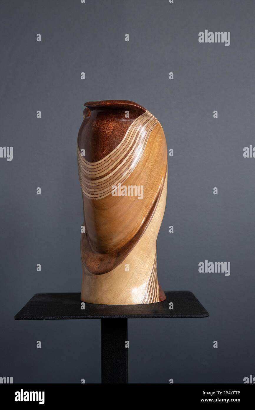Part turned, part carved artistic sculptured decorative wood vessel comprising sapele wood, plywood, tulip wood and sycamore artist Judy Tadman Stock Photo