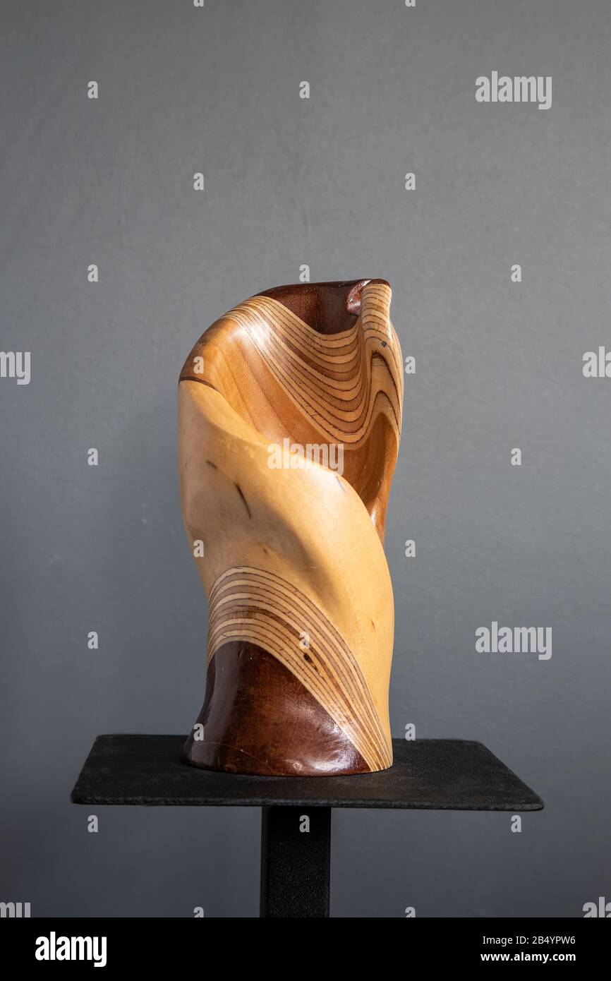 Part turned, part carved artistic sculptured decorative wood vessel comprising sapele wood, plywood, tulip wood and sycamore artist Judy Tadman Stock Photo