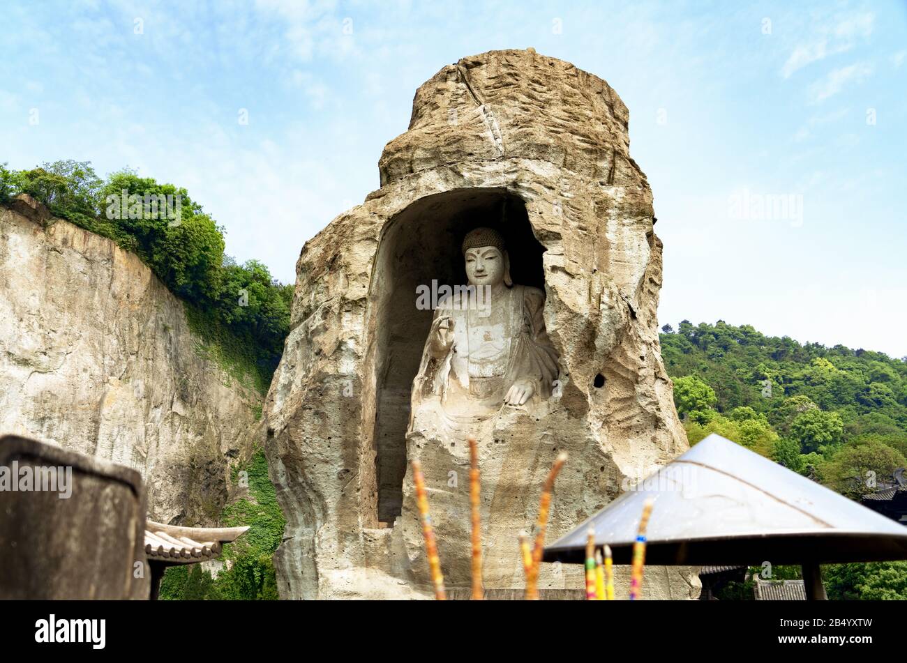 Buddha statue in stone sculpture on blue sky background Stock Photo - Alamy