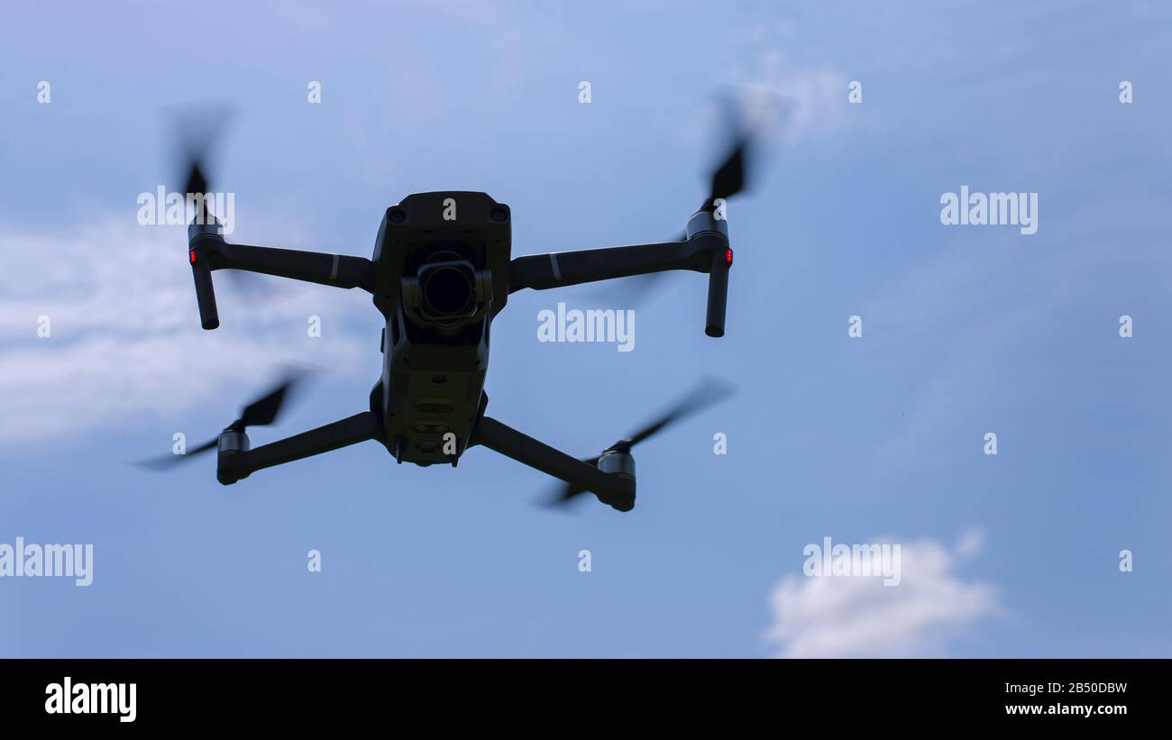 Drone in flight with camera Stock Photo