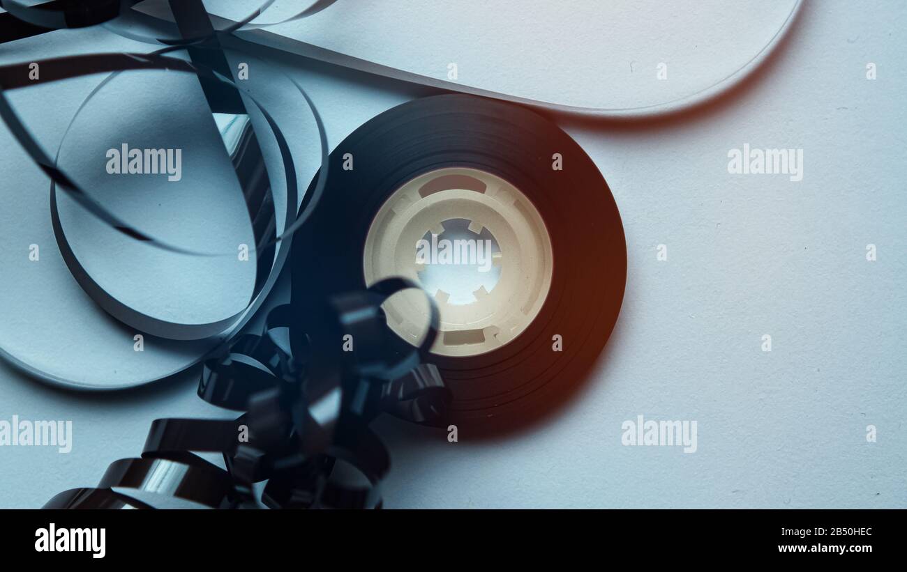 Cassette reel in slow motion over white background. Retro abstract music  background concept Stock Photo - Alamy