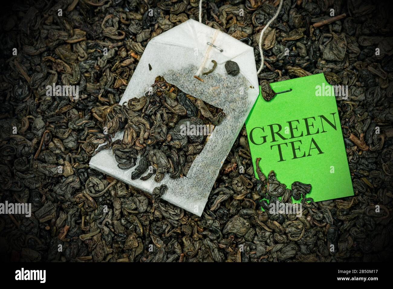 Closeup of a green tea bag, Gunpowder tea, with label on a many dried
