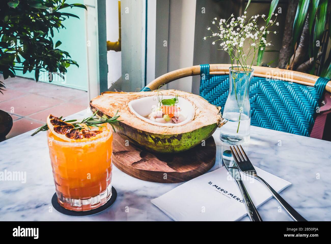 Hamachi and Coconut Ceviche Hamachi aguachile on a fresh, green coconut, hibiscus flower milk