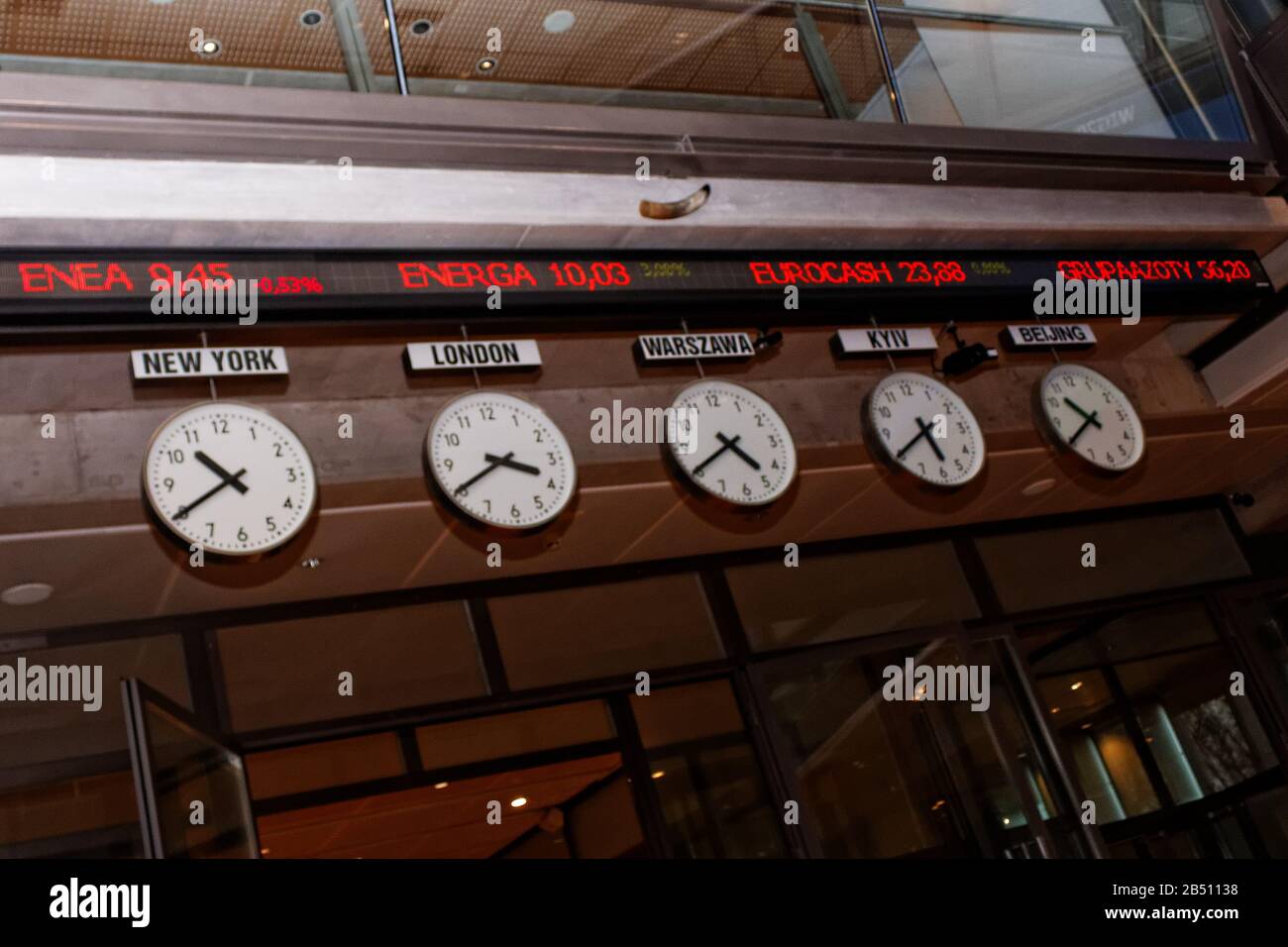 Five clocks in trading room of Warsaw Stock Exchange (WSE, GPW) Stock Photo